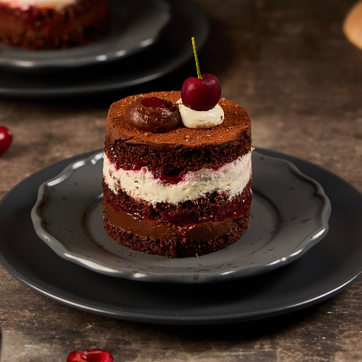Revenge Black Forest Cake with a fresh cherry on top